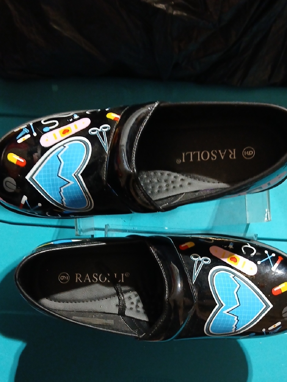 RASOLI Black Patent Nursing Shoes with Blue Heart Graphics